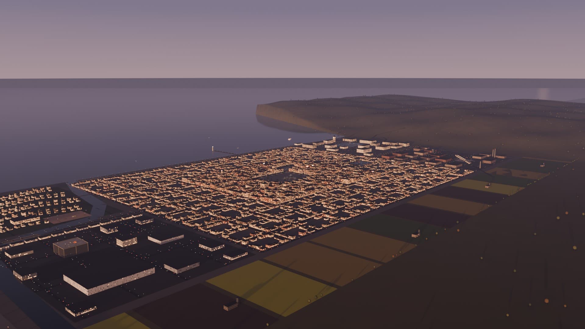 Open York from the south-west at dusk, 430 m up: the core grid, the hills and the sea