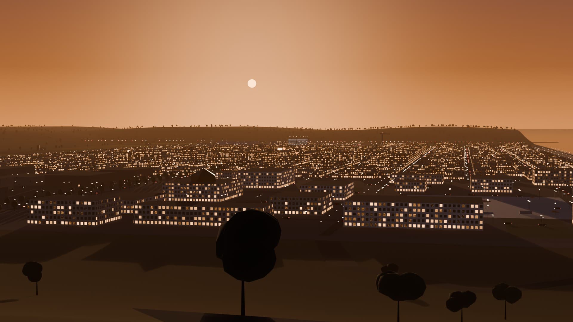 Open York from Quarry Hill at sunset, windows lit, the sea to the right